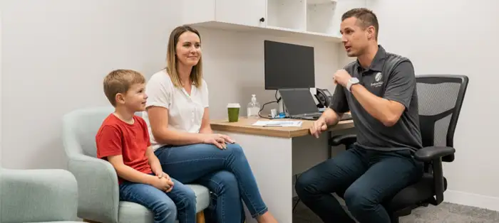 Paediatric consultation room with a child and caregiver