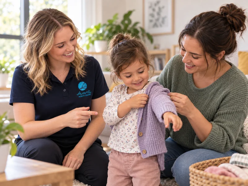 Occupational therapist coaching a parent as their child practises putting on a cardigan