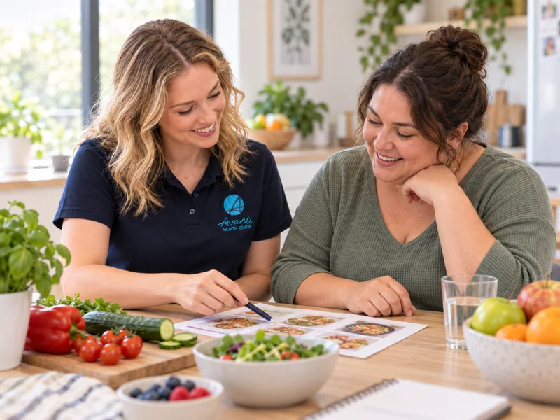 Dietitian and client planning everyday meals together at a consultation table